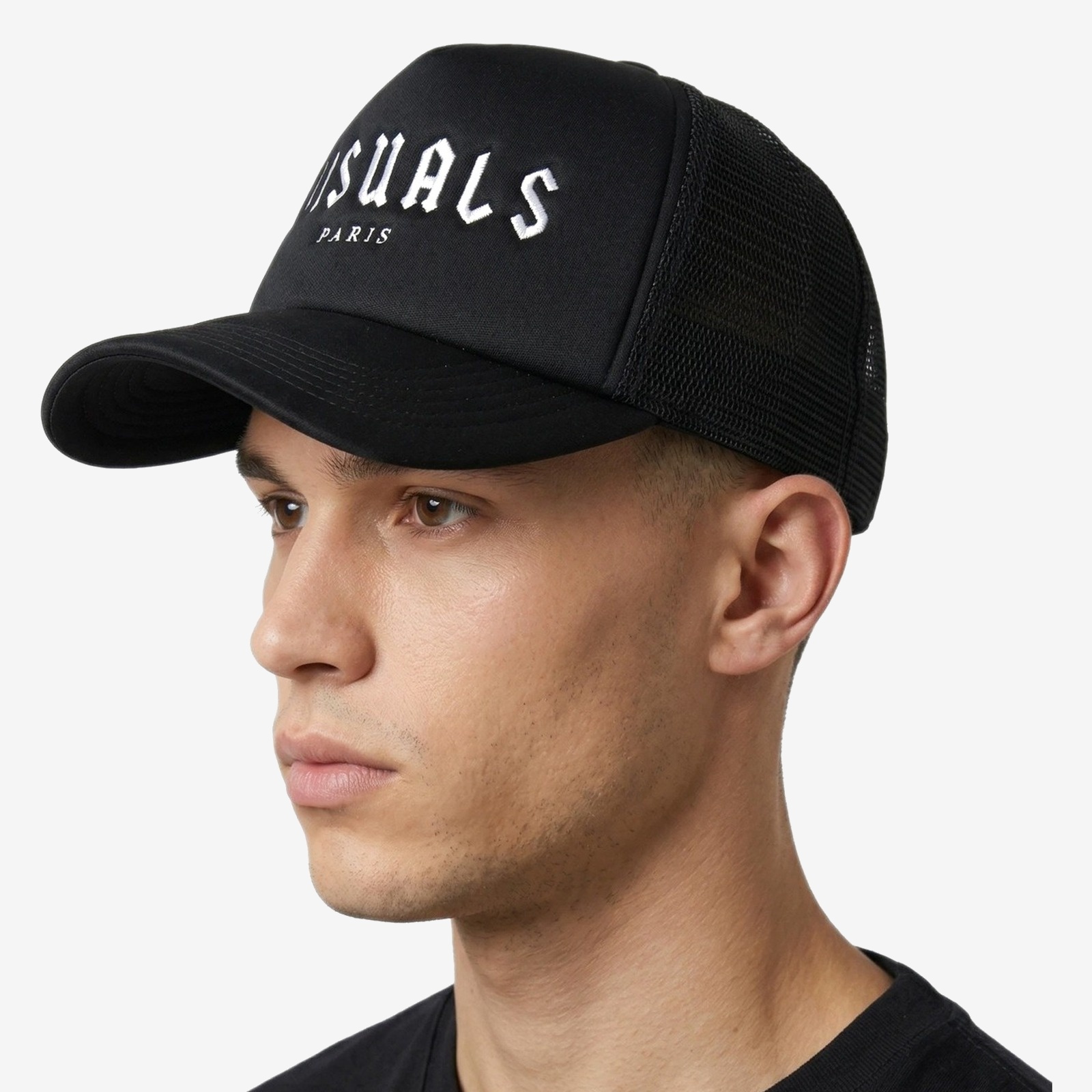 Blanc Trucker Cap in Black — worn by a model
