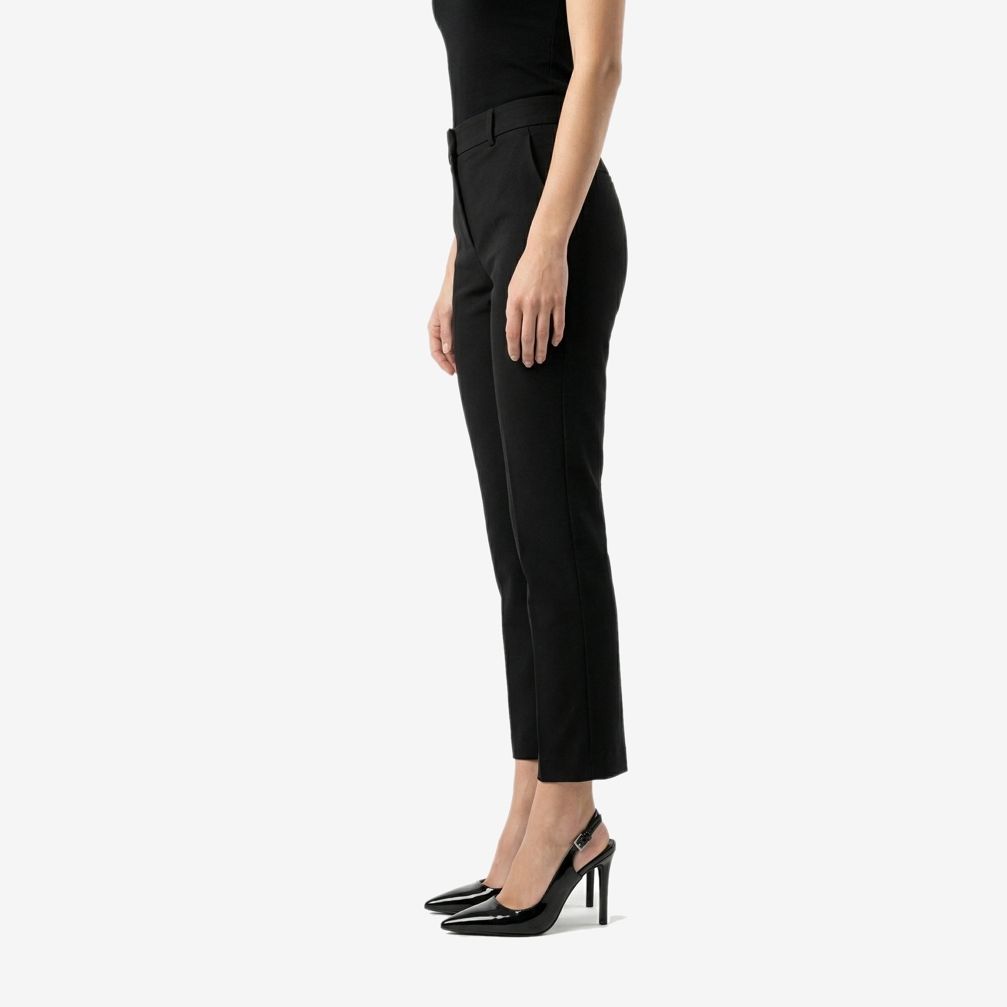 Noir Slingback Stiletto in Noir Patent — worn by a model
