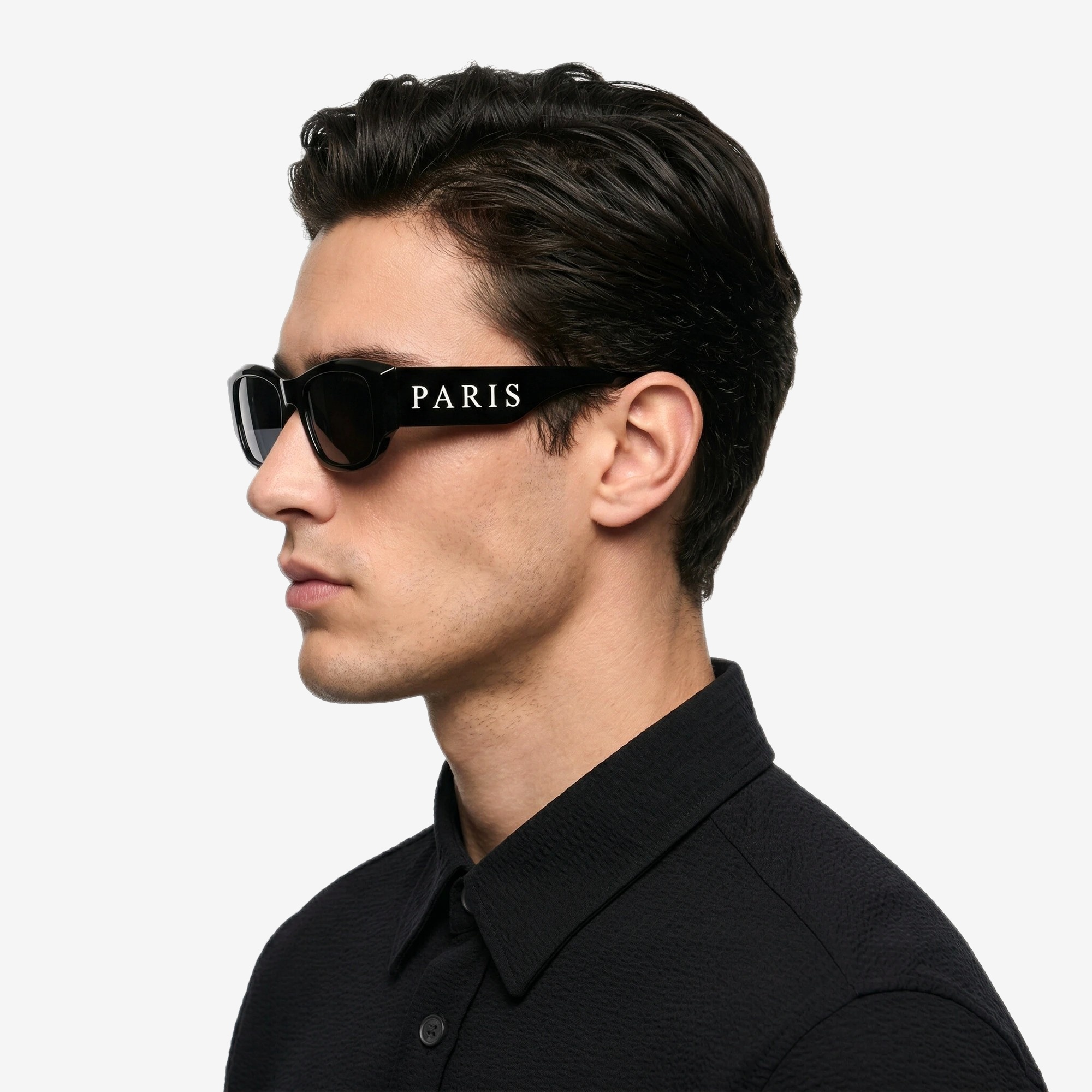 Couture Gothique Sunglasses in Noir Black — worn by a model