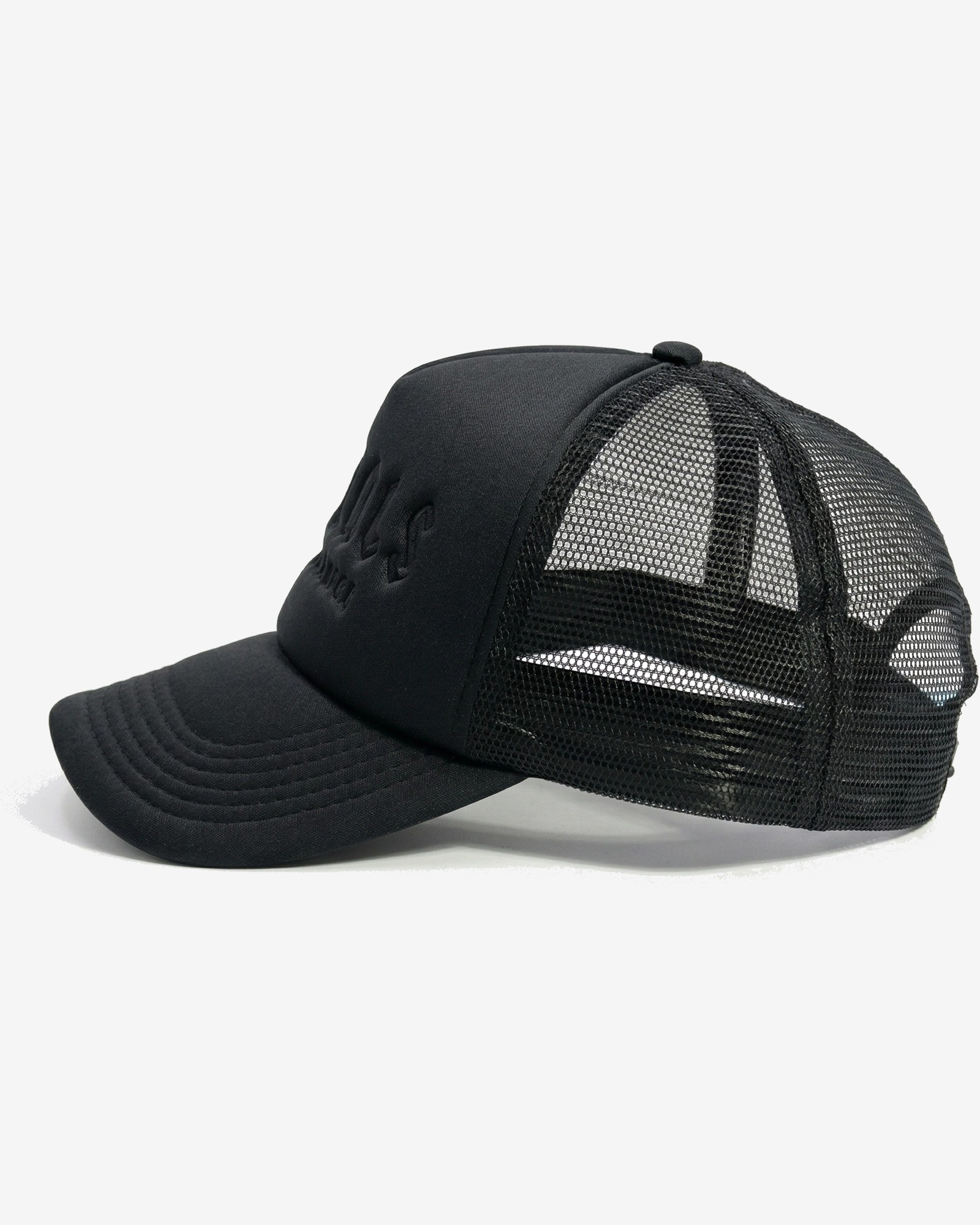 Noir Signature Trucker Cap in Tonal Black — worn by a model